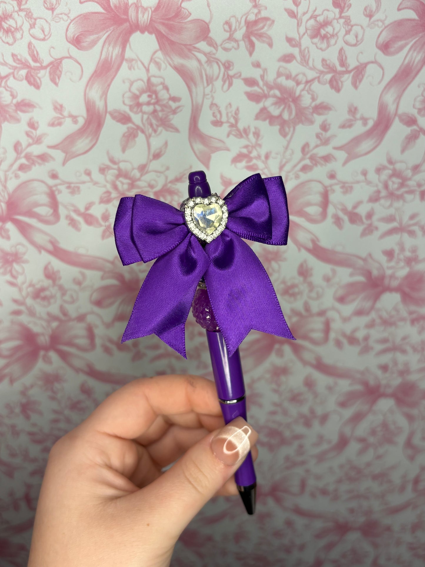 Purple bow pen