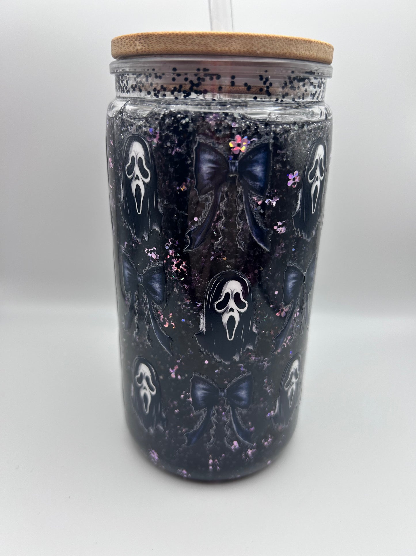 Ghost, face  16 oz plastic fast flow snow-globe tumbler.