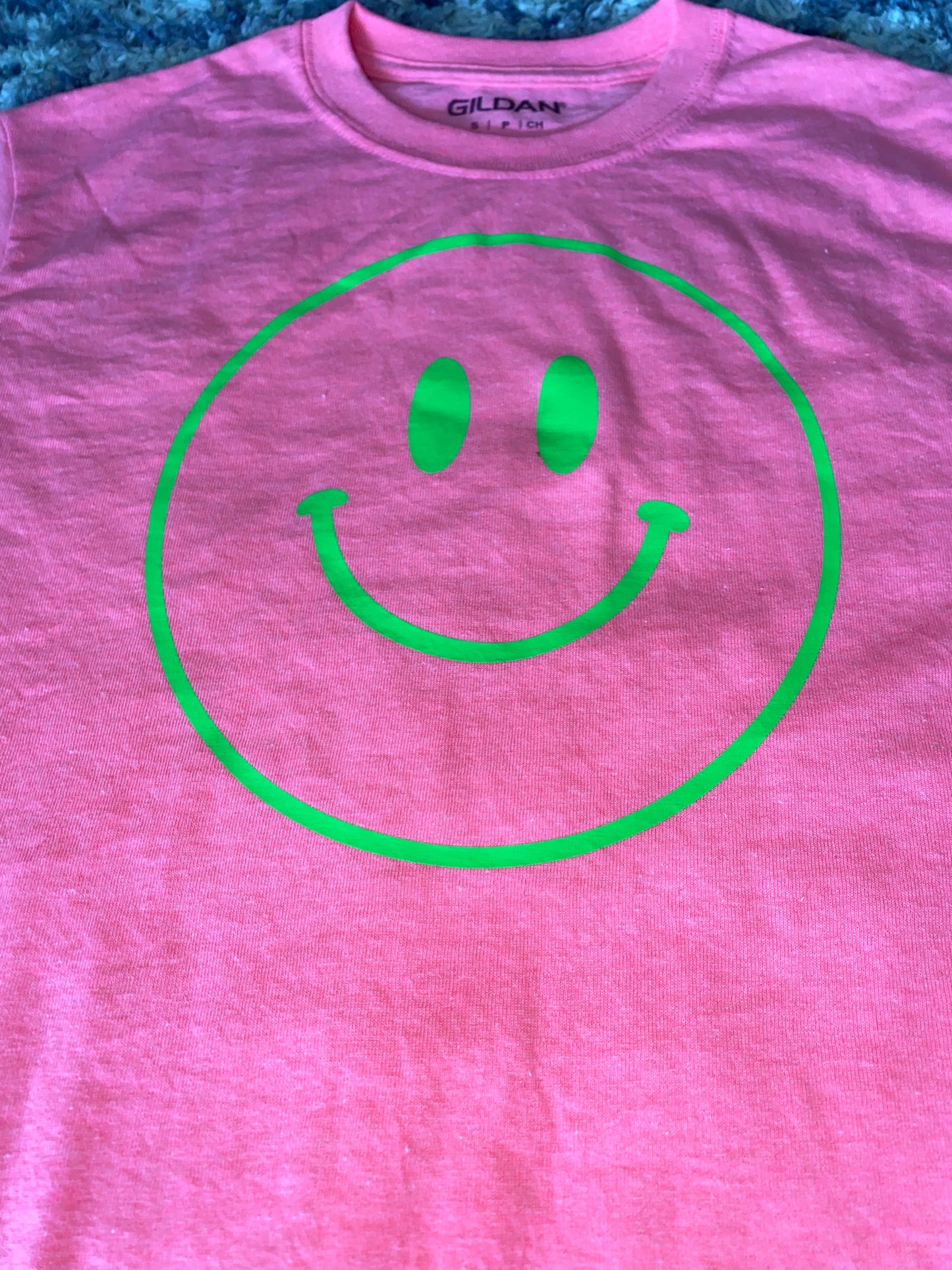 Smiley face t-shirt message for different T-shirt colors